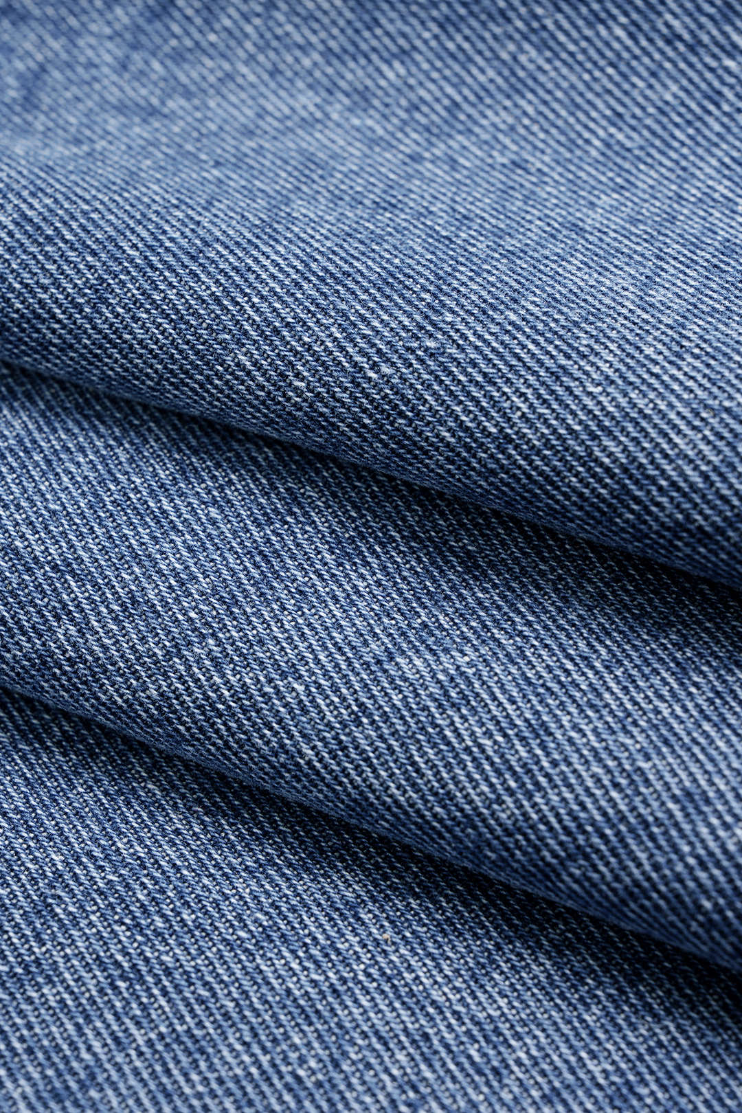 Denimiset epäsymmetriset napilliset shortsit